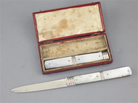 A cased Georgian silver and mother of pearl folding travelling fruit knife and fork,